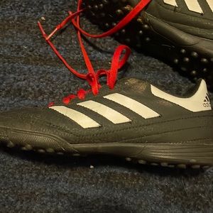 Adidas Soccer shoes  color is red white and black in decent condition size 4